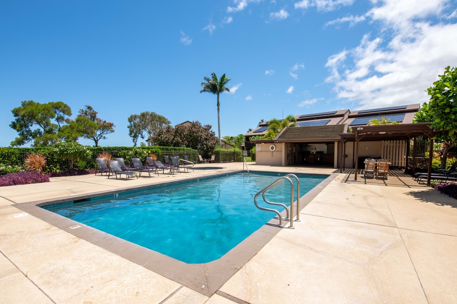 Lounge poolside at Cabana A, featuring a sparkling pool, heated jacuzzi, and plenty of sun-soaked seating to unwind in paradise.