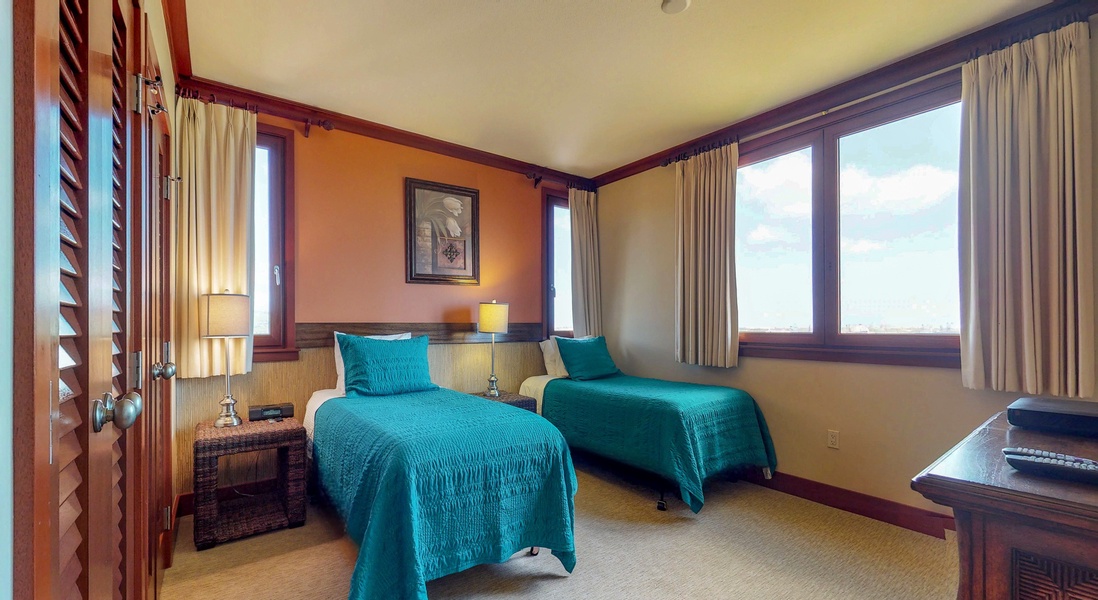 The third bedroom has extra long twin beds for a restful stay.