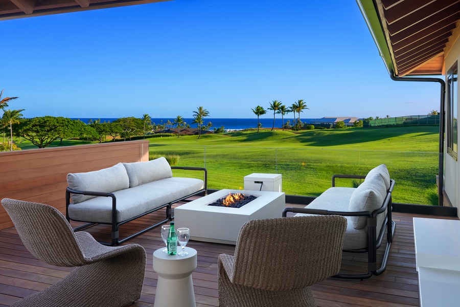 Outdoor living space with panoramic fairway and ocean views.