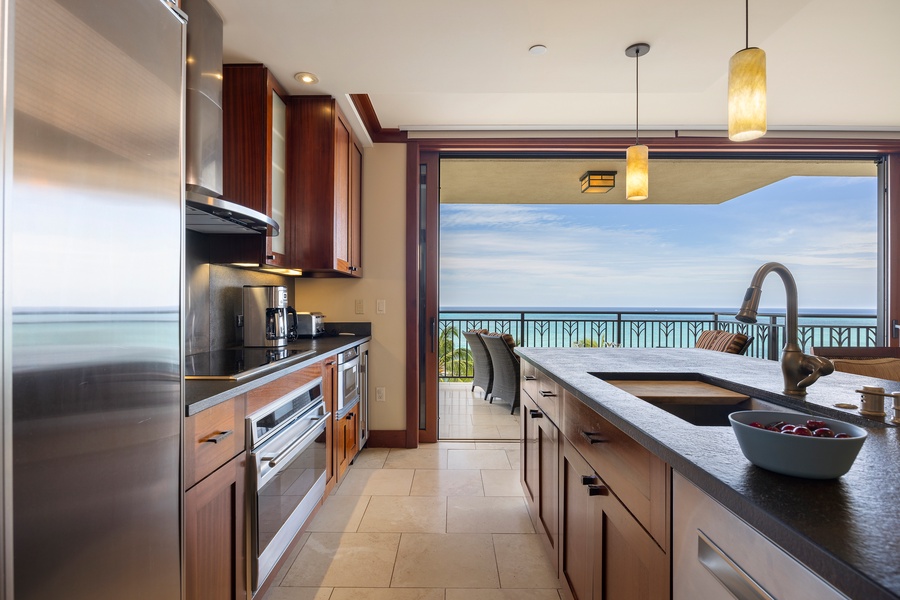 Your gourmet kitchen opens to breathtaking ocean views, where cooking becomes pure joy with premium appliances and endless blue horizons.