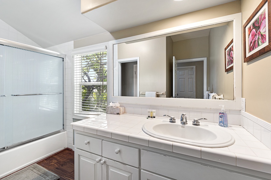 Guest bathroom with two entrances shared by the three guest bedrooms on the upper level