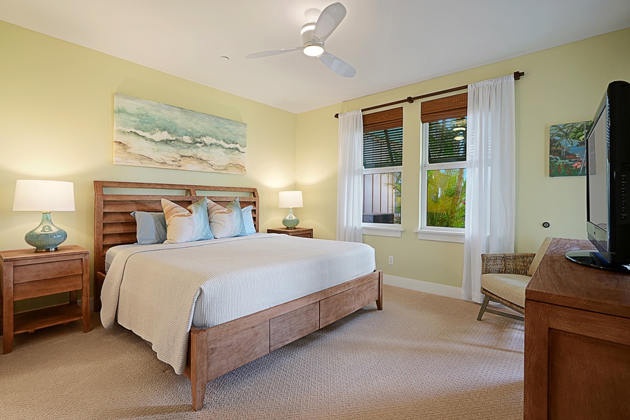Primary suite with king bed, garden outlook, and soothing decor for restful nights in Poipu.