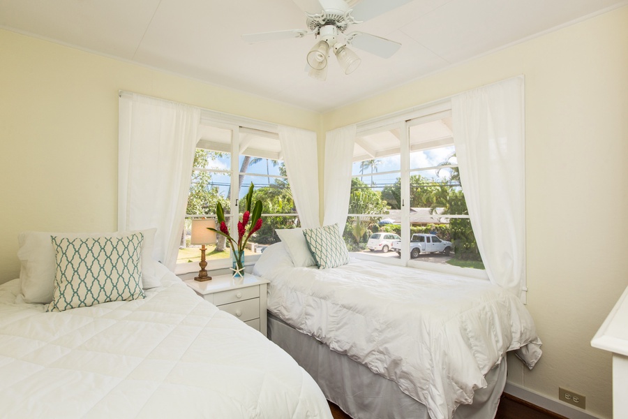 Main house bedroom two, with twin beds (convertible to a king upon request) and new split air conditioning system.