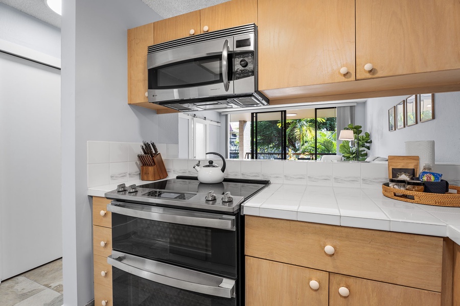 Cozy kitchen featuring a full stove and functional counter space.