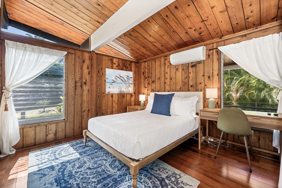 Rest peacefully in your sanctuary, where crisp linens and flowing curtains create a cozy retreat with air conditioning for comfort.