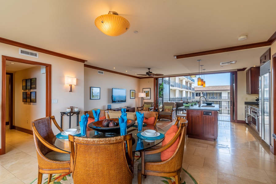 The spacious dining and living area with blue sky views.