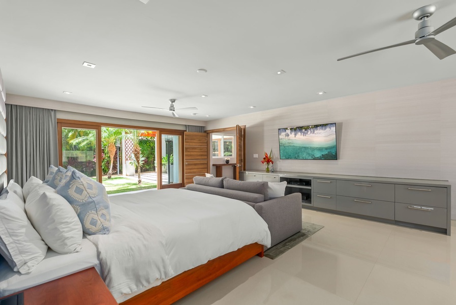 Unwind in your spacious bedroom suite with tropical garden views, modern comforts, and a serene palette that invites pure relaxation after your day exploring.