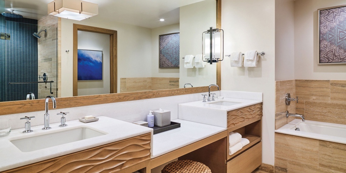 The spa-like bathrooms at Hokuala feature deep tubs, separate showers, and dual vanities.