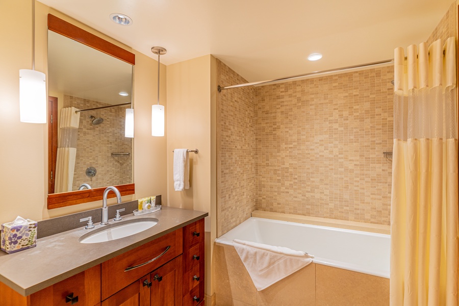 The third guest bathroom is also a full bath with a shower tub combo.