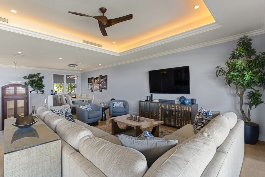 Gather in the spacious living room at Wailea Luxury Residence Hoolei 23-3—modern, cozy, and inviting.