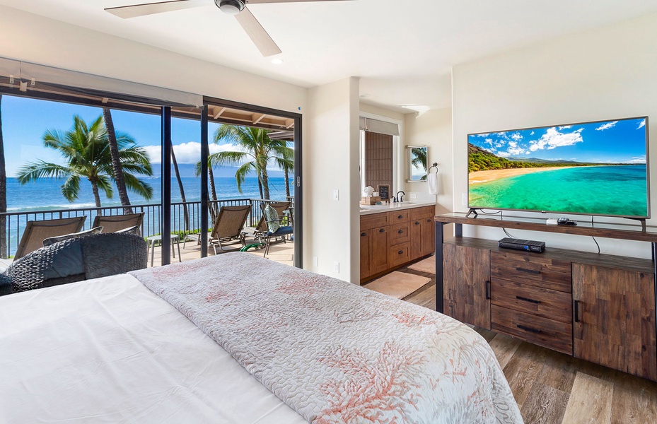 Relax in this elegant bedroom featuring a luxurious king-size bed and stunning oceanfront views.