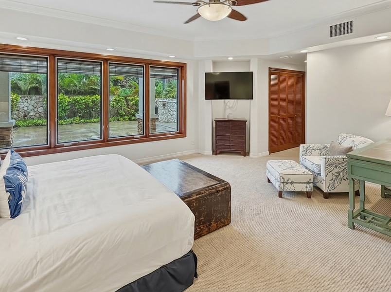 Unwind in your tropical retreat with garden views, plush seating, and modern amenities creating the perfect peaceful escape.