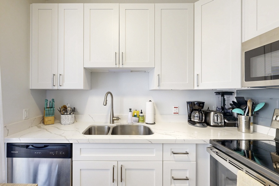 Full kitchen with modern appliances and essentials.
