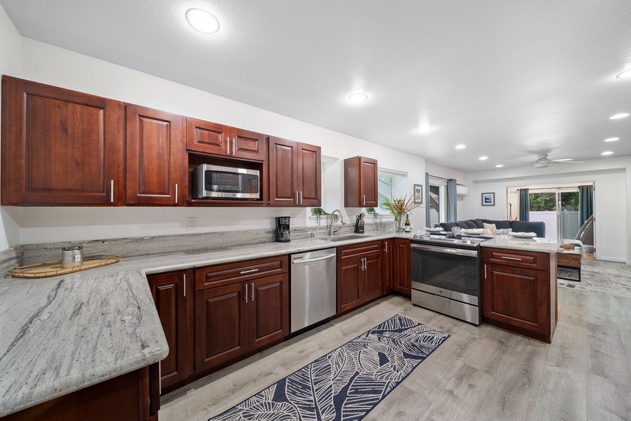 Second fully equipped kitchen with stainless steel appliances