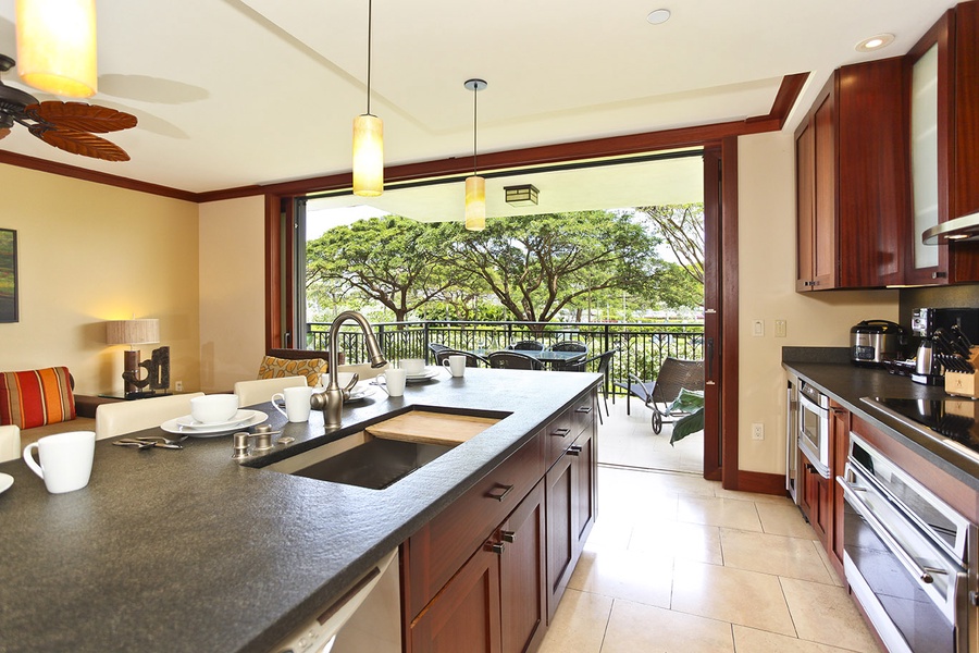 A fully equipped kitchen for your culinary delight and ocean breezes from the lanai.