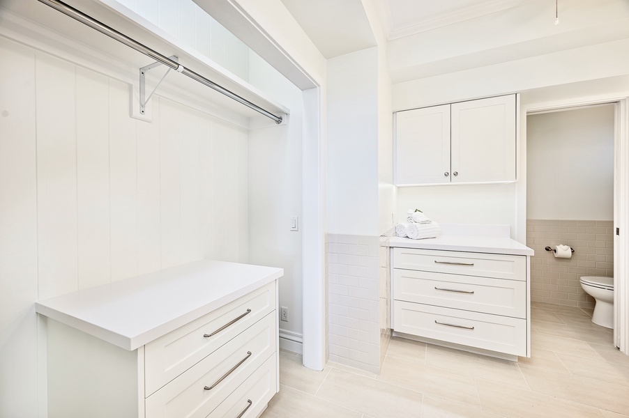 The primary ensuite is a full bath with a wardrobe