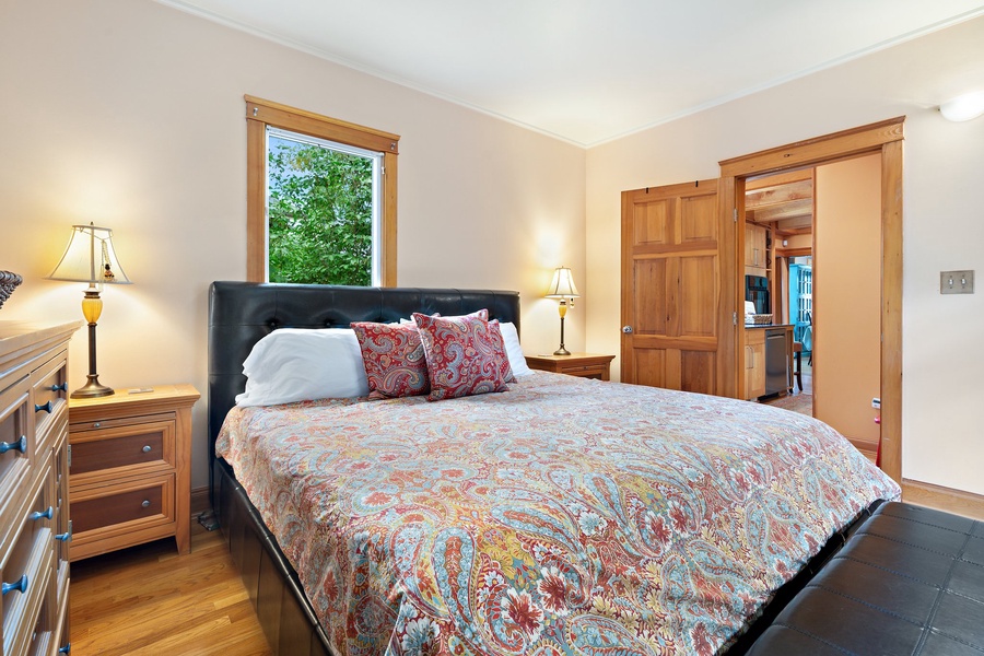 A delightful bedroom with large windows, ideal for soaking in the natural light.