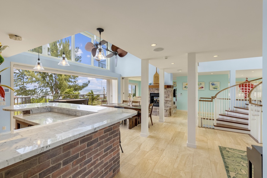 Bright and airy living area with large glass window walls.