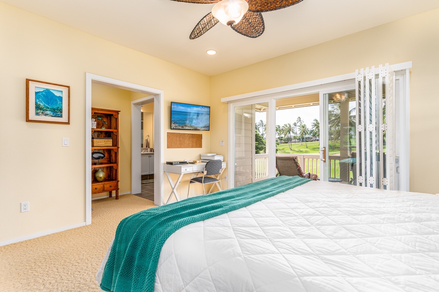 The primary guest bedroom upstairs with TV and access to the lanai.