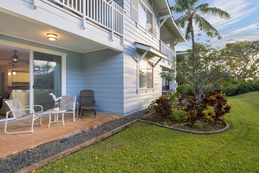 Step out to your private lanai where comfortable seating awaits amidst lush tropical gardens and swaying palms.
