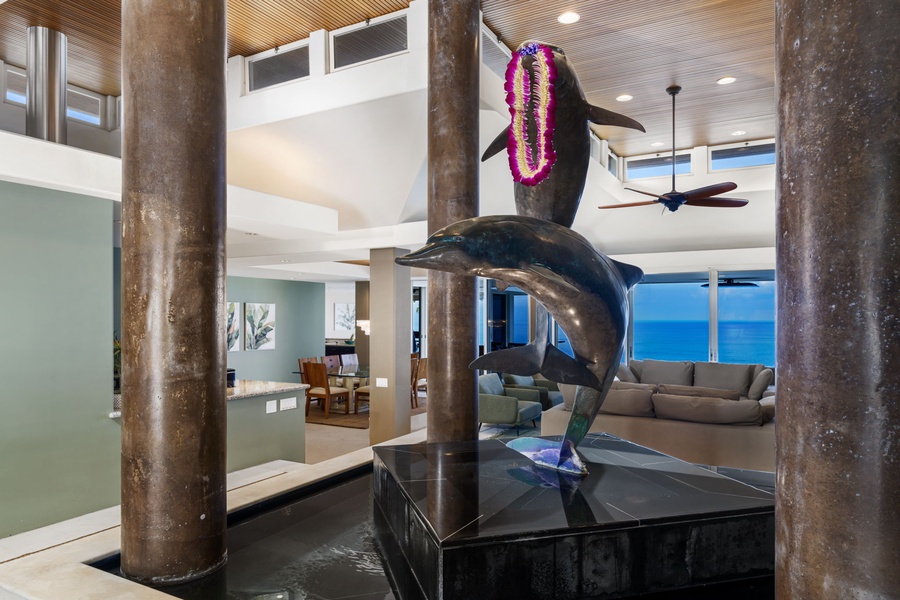 Step into your tropical paradise where whale sculptures welcome you to an oceanfront sanctuary with stunning sea views.