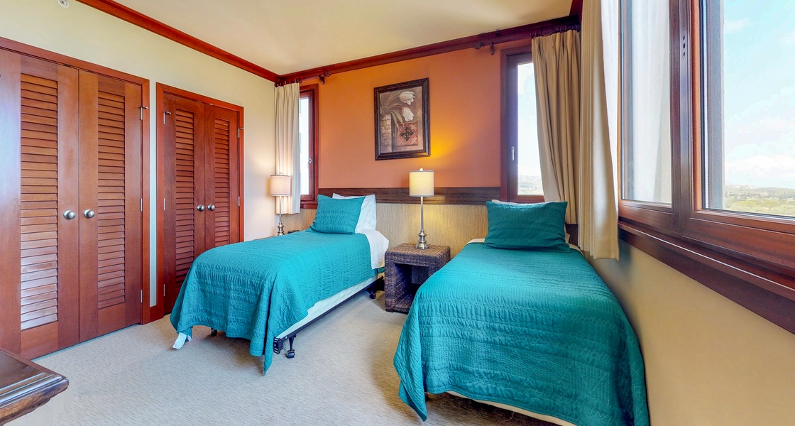 The third guest bedroom with bright views and colorful decor.