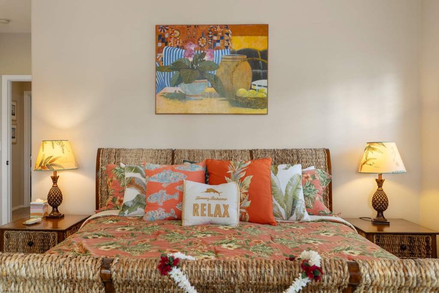 The primary guest bedroom with soft linens and vibrant patterns.