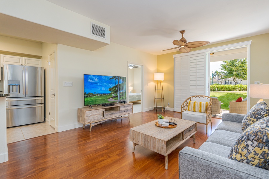 The living area with TV, plush couch and direct access to the lanai.