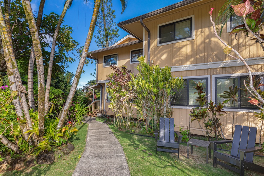 A garden path leads to this charming three-bedroom cottage in the heart of Princeville.
