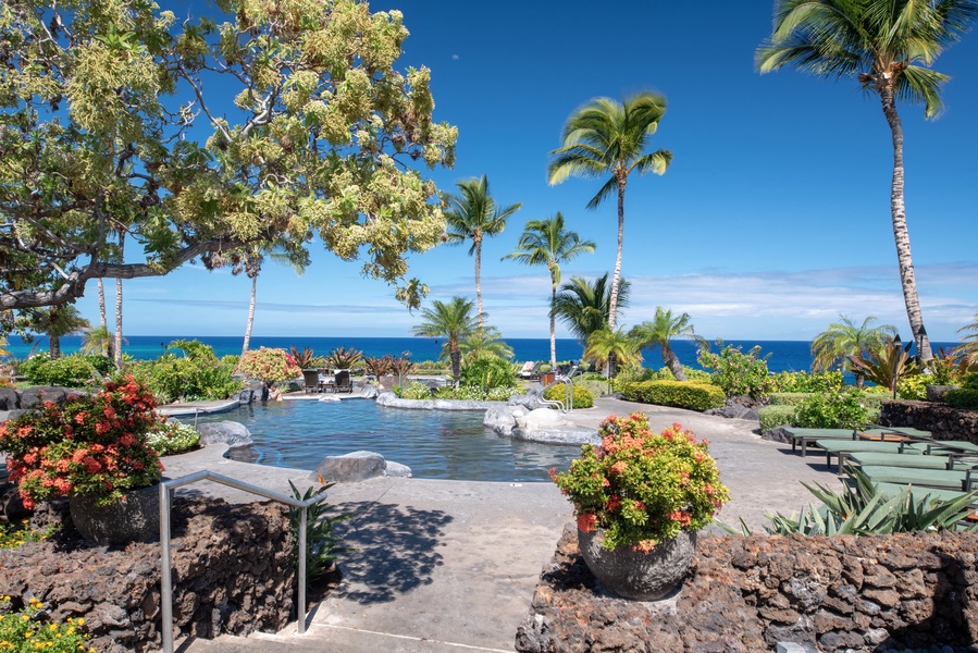 Hali'i Kai Resort's private pool w/ numerous lounge chairs to soak up the tropical sunshine!