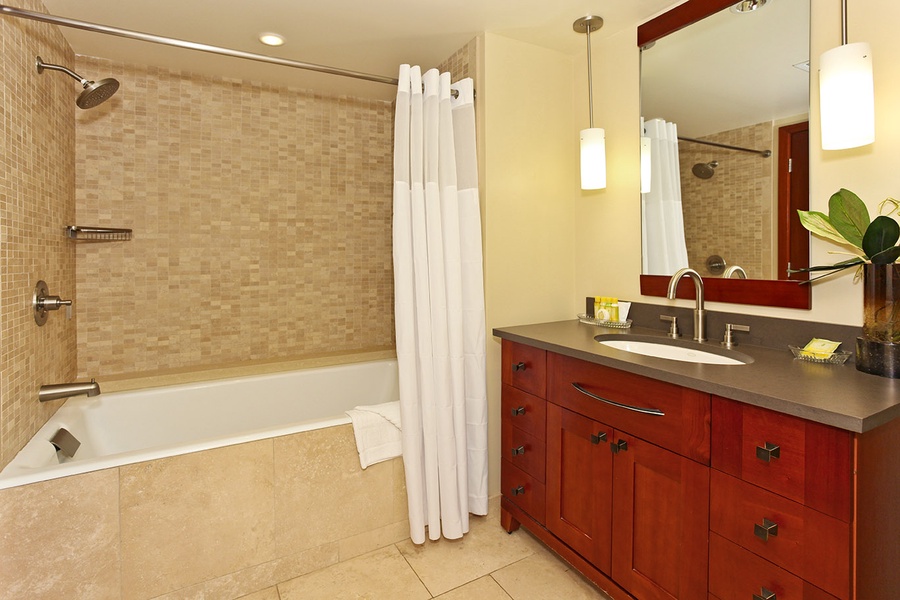 The third guest bathroom has a shower- tub combo. Take a luxurious soak during your stay.