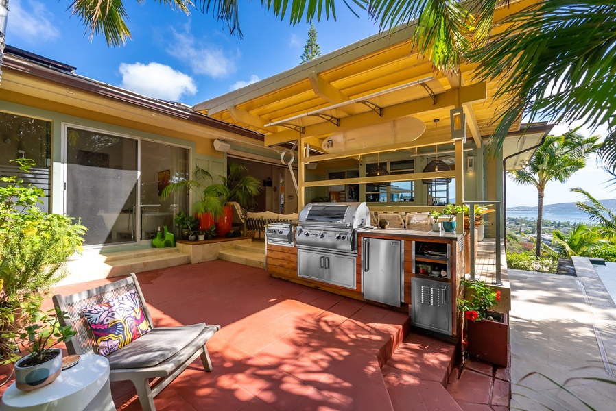 Prep and serve meals with ease at the built-in BBQ under swaying palms.