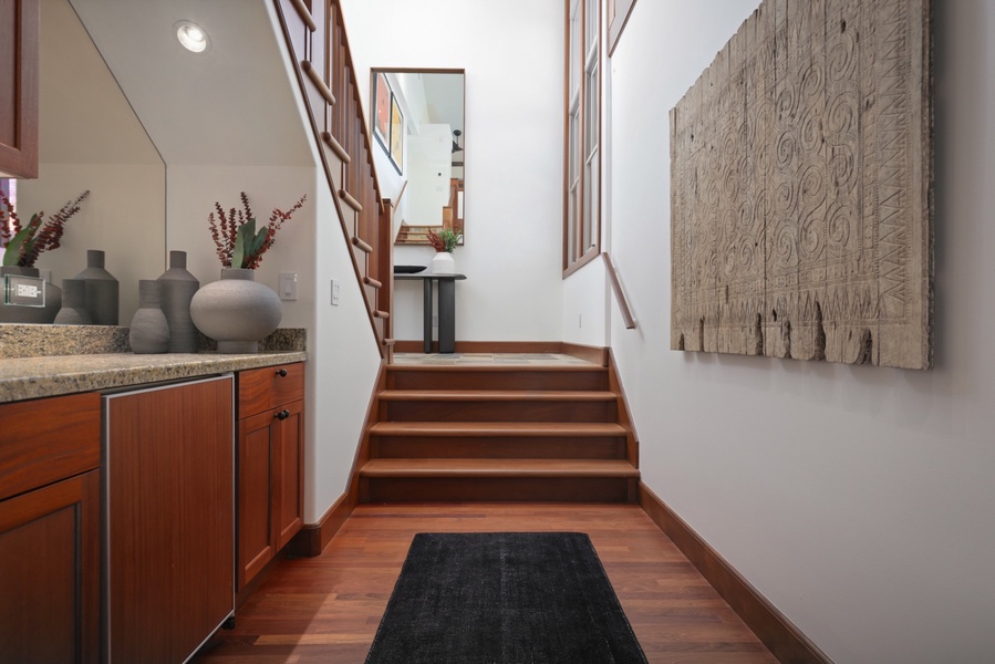 Indoor wet bar located at the bottom of the staircase.