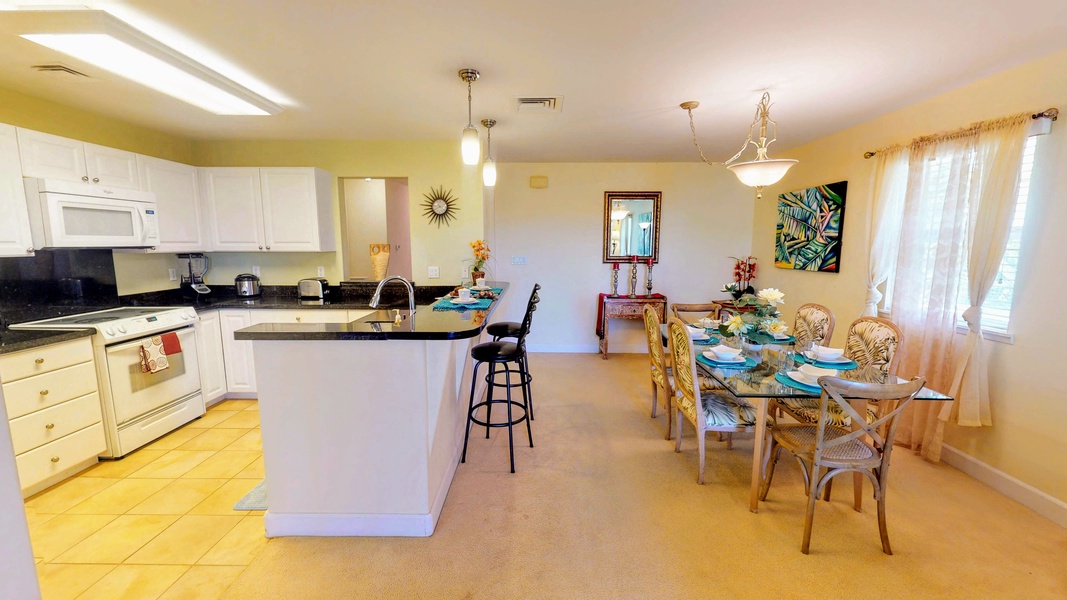 The open floor plan includes kitchen, dining and living areas.