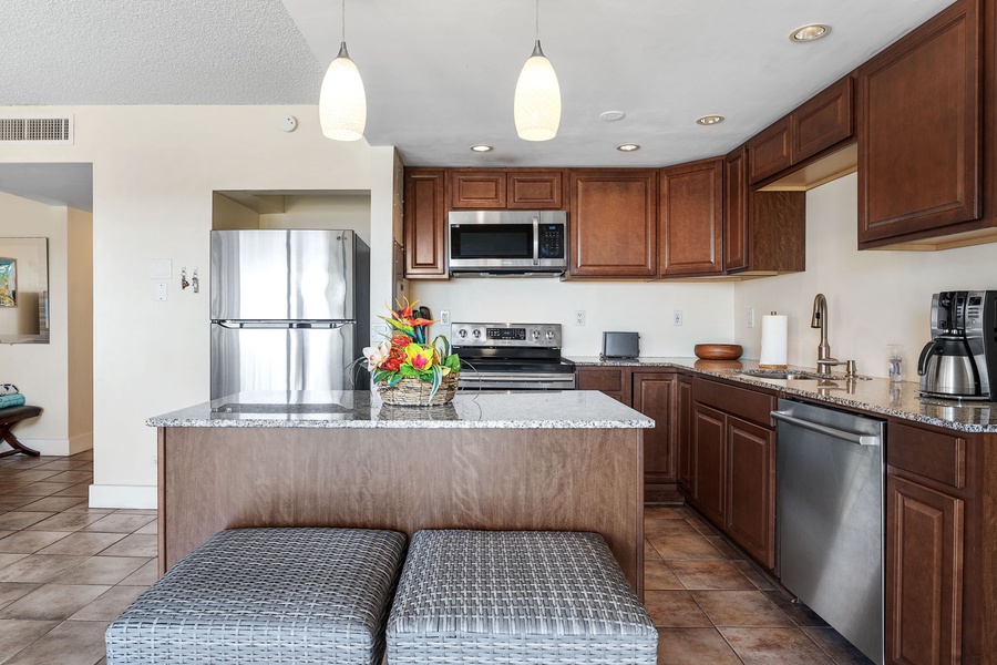Elegant kitchen with bar seating, perfect for quick breakfasts or casual dining.