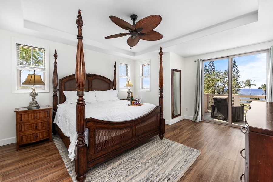 Primary bedroom with a regal king bed and elegant furnishings.