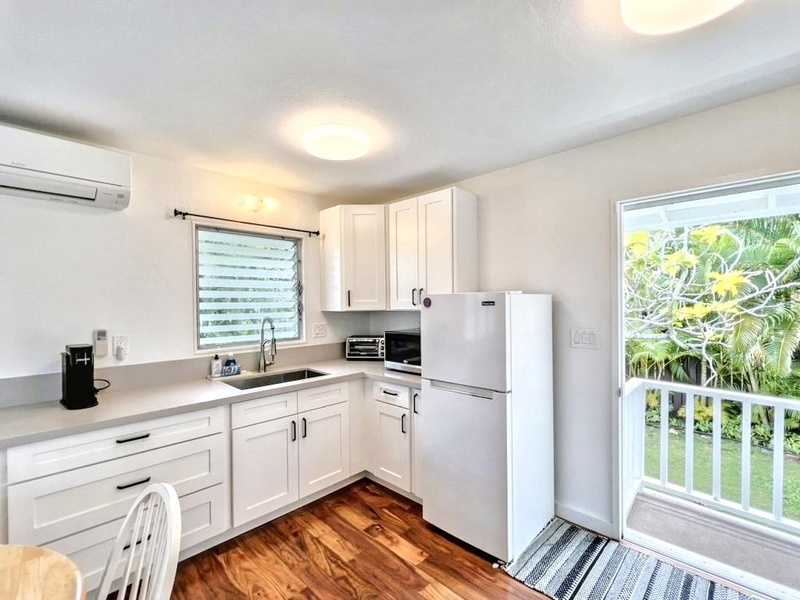 The cottage studio kitchenette is fully equipped for light cooking and convenient meal prep.