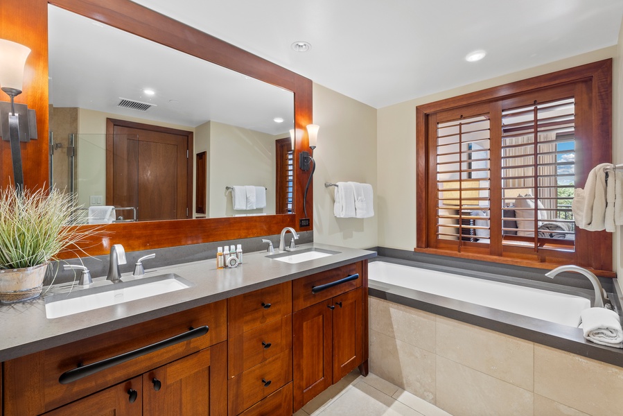The primary guest bath is a full bathroom with a double vanity.