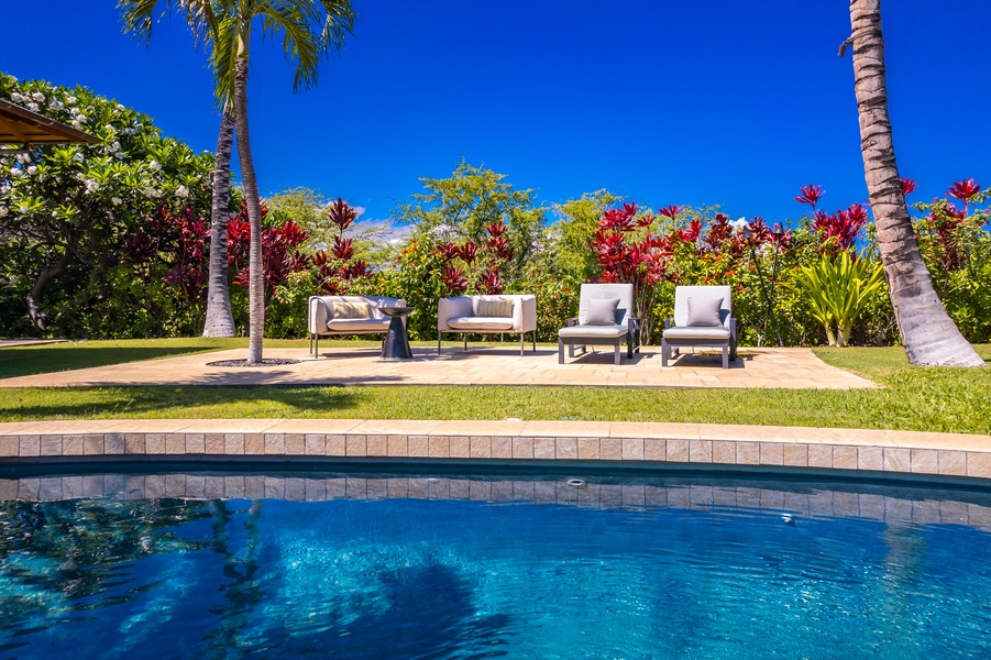 Relax by the poolside and enjoy the tropical views.