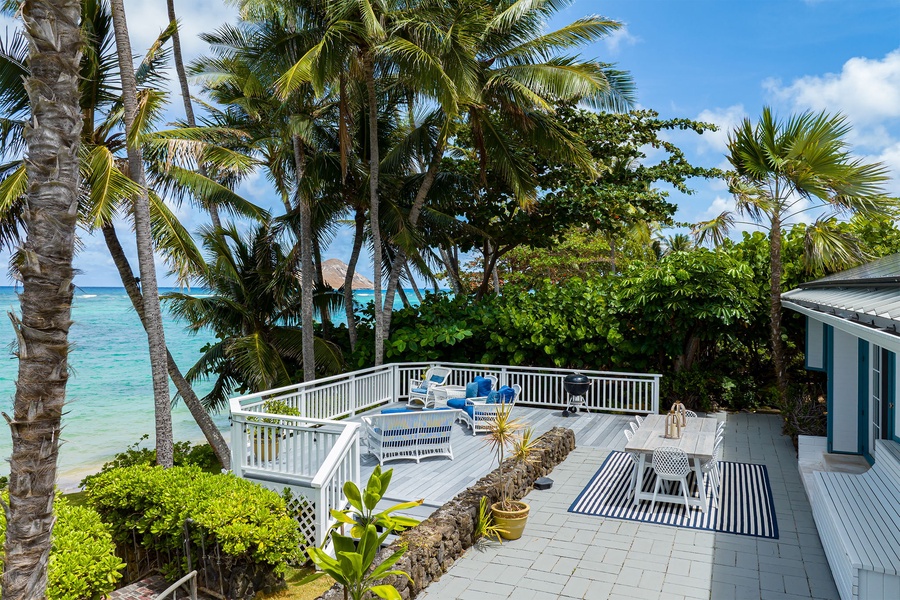 Spacious lanai decked with ample outdoor furniture, and a perfect table setting for alfresco dining amidst gentle breezes.