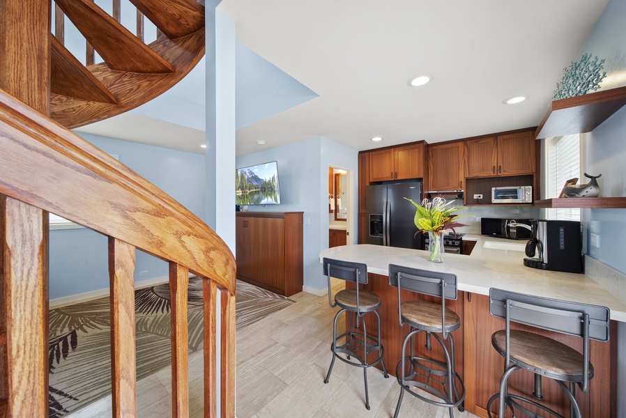 Right by the kitchen there are the stairs leading to the one bedroom-one bathroom