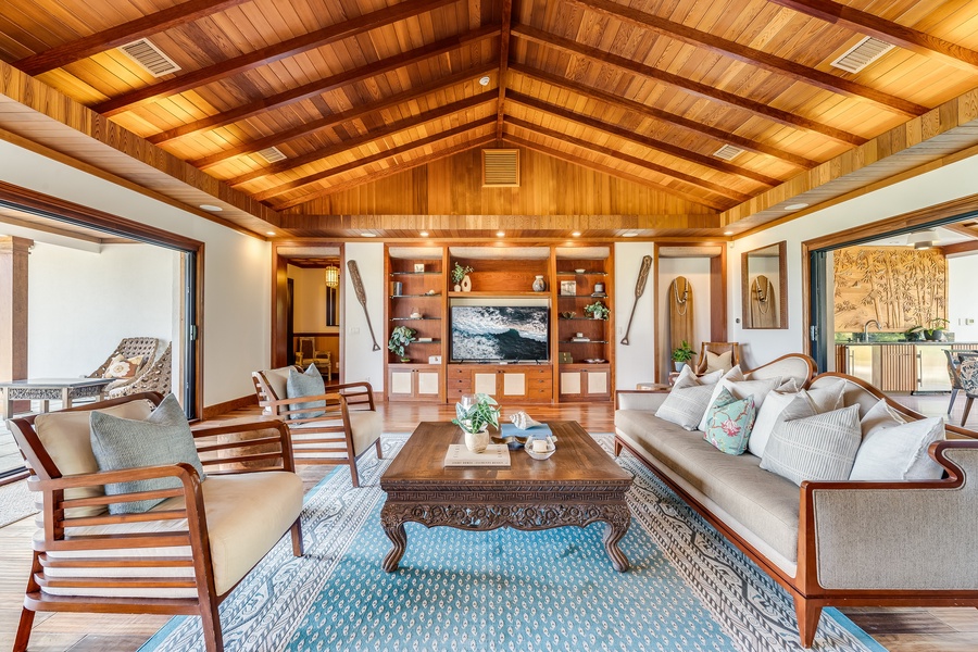 Warm lighting and natural textures make this spacious lounge ideal for evening gatherings.