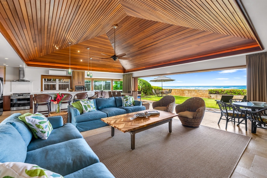 Soaring vaulted ceilings frame the oceanview living room, blending island elegance with open-air comfort.