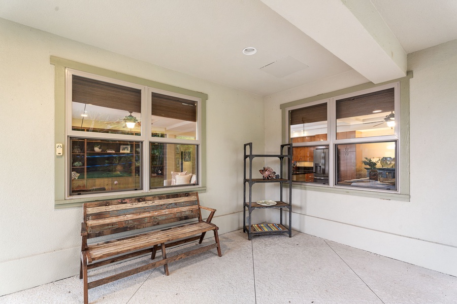 Covered patio space featuring additional seating for enjoying the fresh island breeze.