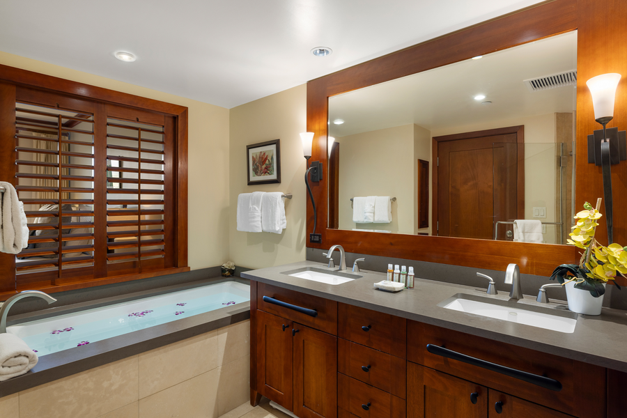 The primary ensuite featuring a large soaking tub is the perfect relaxation retreat.
