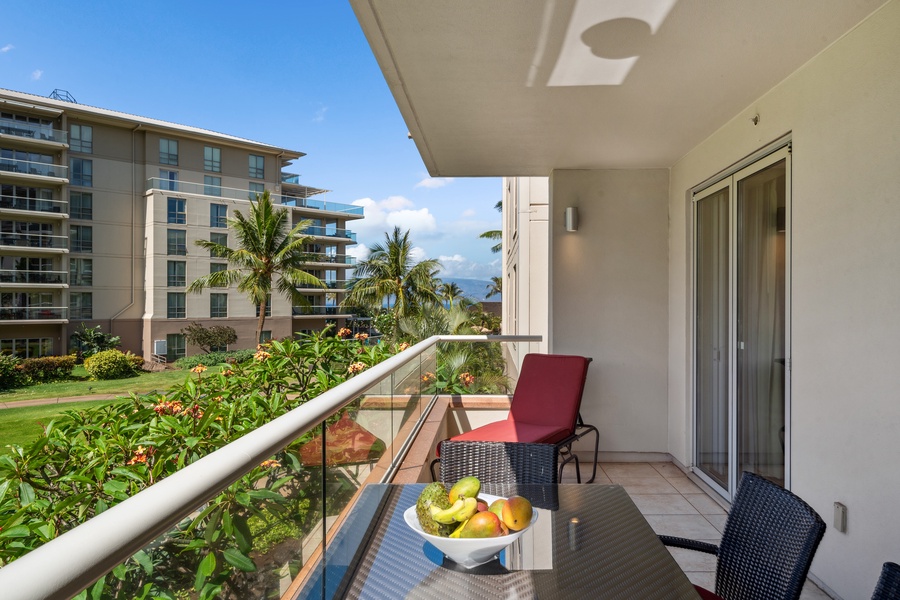 Cozy corner seating on the Honua Kai Konea 204 lanai offers the perfect hideaway with a view.