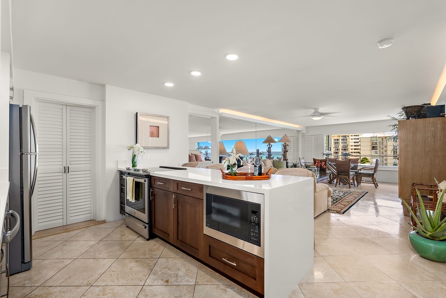 Streamlined functionality meets island flair with this central prep island featuring storage, built-in microwave, and ample surface space.