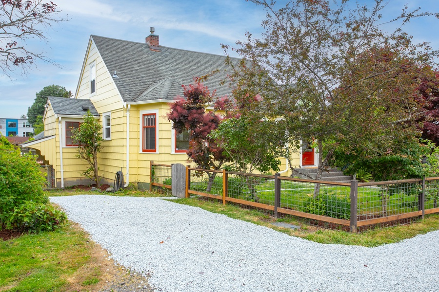 Easy-access driveway and tidy yard provide off-street parking and a picture-perfect first impression.