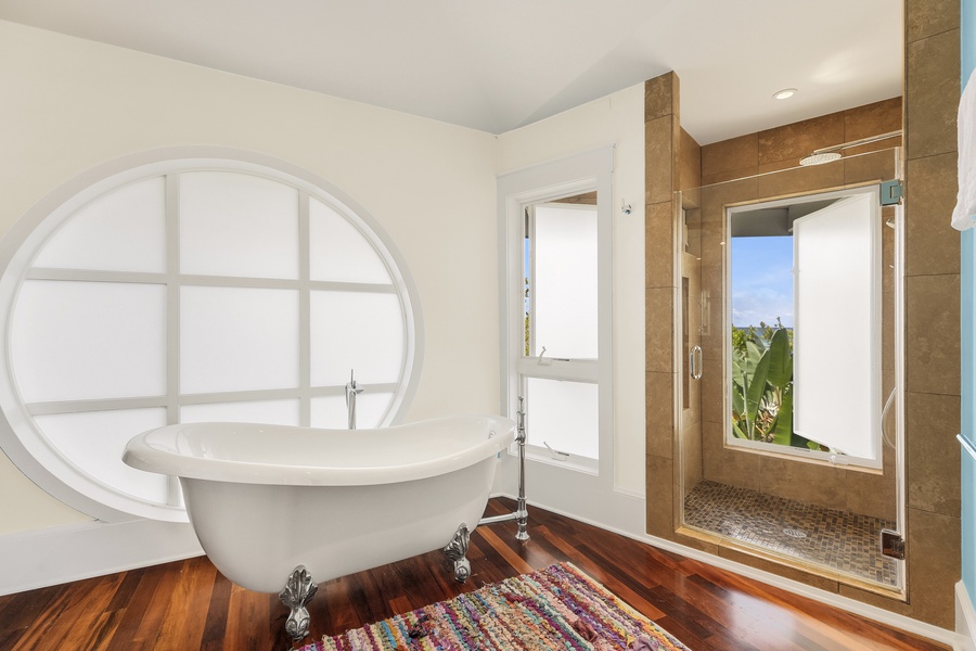 Plus, step into the walk-in shower with killer views of the lush, tropical greenery that surrounds