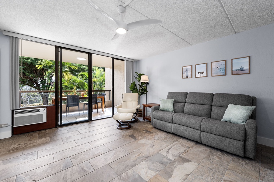 Open-plan living and dining area with stylish decor and tiled floors.